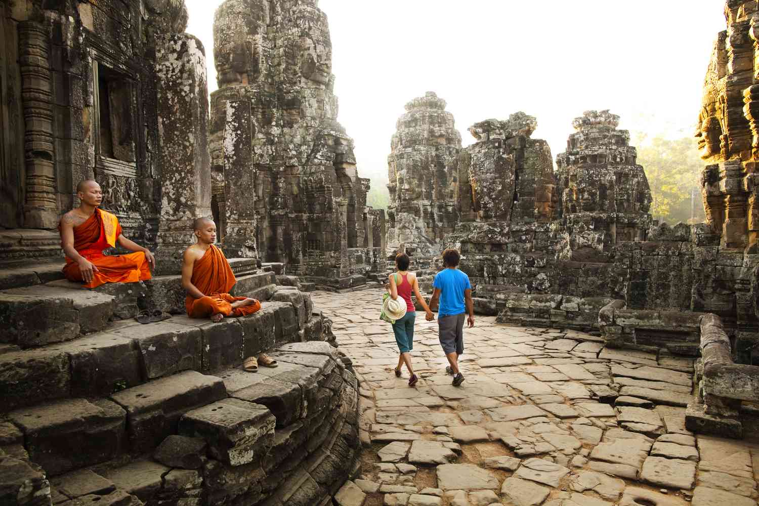 couple-visiting-buddhist-temple--angkor--siem-reap--cambodia-470623341-5add0ca1ae9ab800387ea468